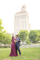 man slow dancing with a woman wearing a maroon dress in downtown Asheville