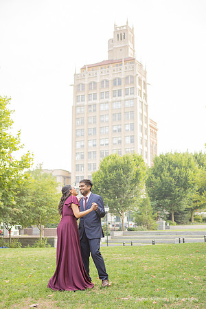 man slow dancing with a woman wearing a maroon dress in downtown Asheville