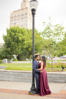 couple kissing next to a street light in downtown asheville