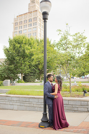 couple kissing next to a street light in downtown asheville