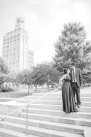 black and white photo of a couple looking at each other in downtown asheville