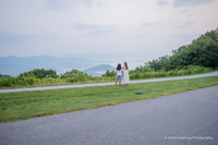 a woman proposing to another woman in the mountains