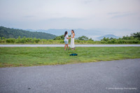lesbian couple dancing in the mountains