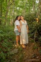 Two Girls Nose to Nose in the forest