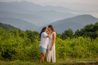 Two Girls Wearing White Kissing in the Mountains