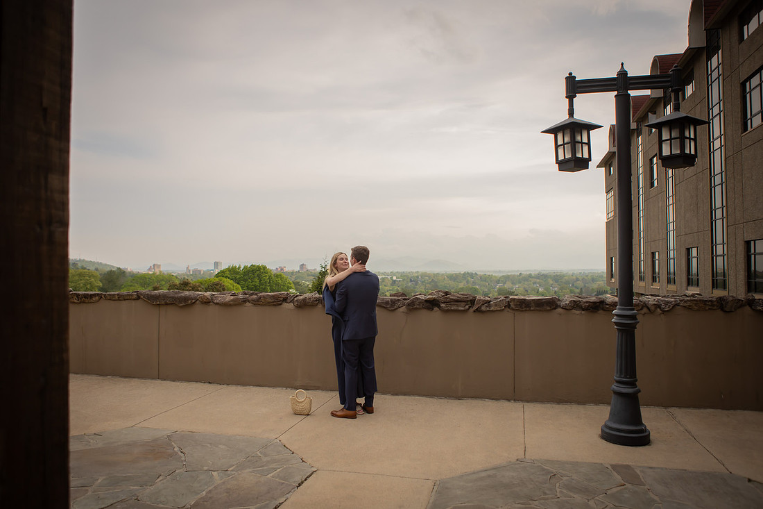 Proposal at Omni Grove Park Inn Vanderbilt Terrace with view of Asheville Downtown | Engagement Photography