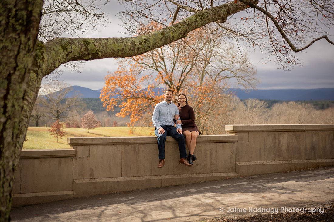 Couple Sitting on a Wall at the Biltmore Estate in Fall
