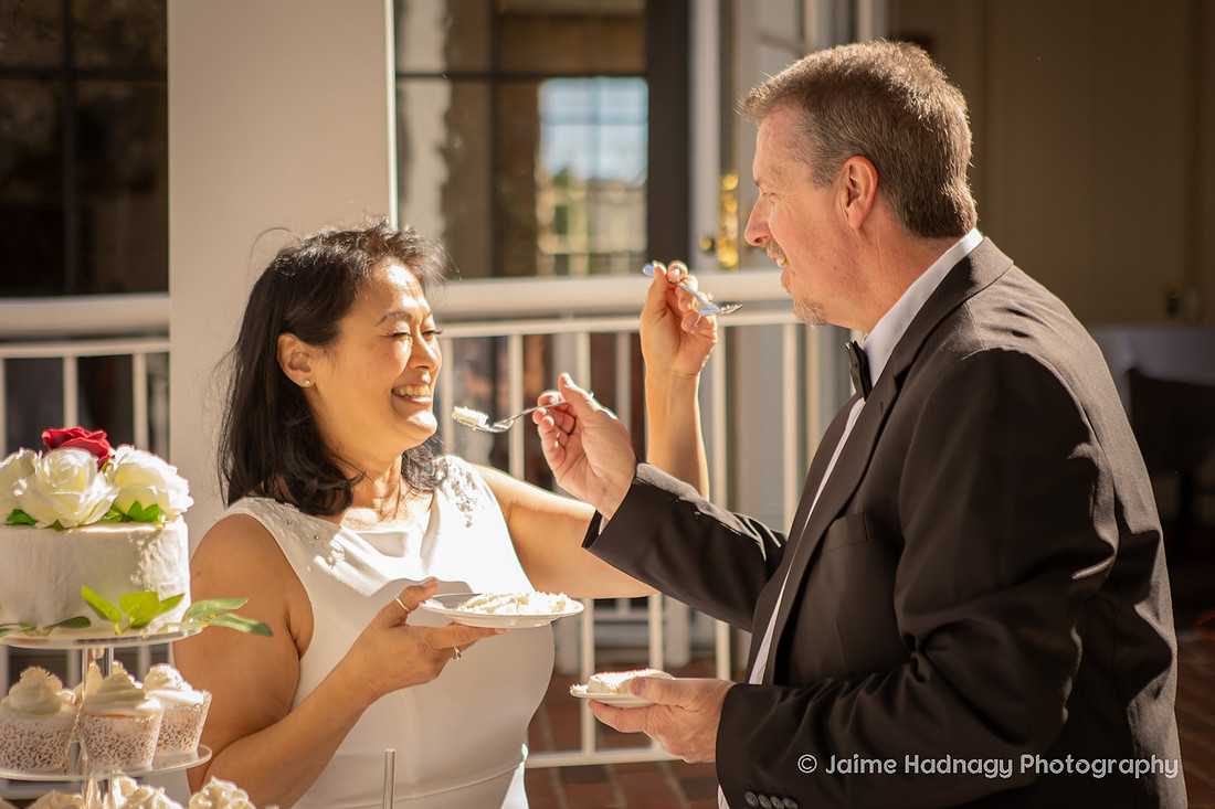 Bride and Groom eating Wedding Cake
